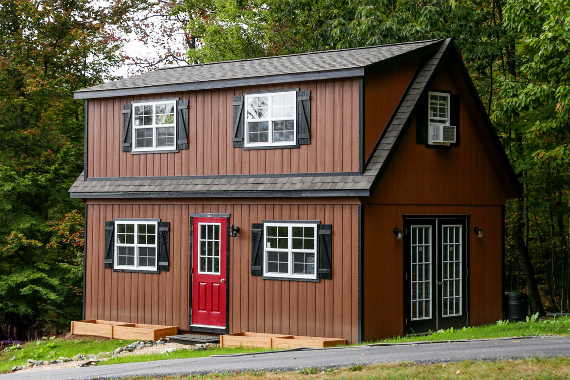 A relevant stock photo of 2 storey garden shed in a typical setting.