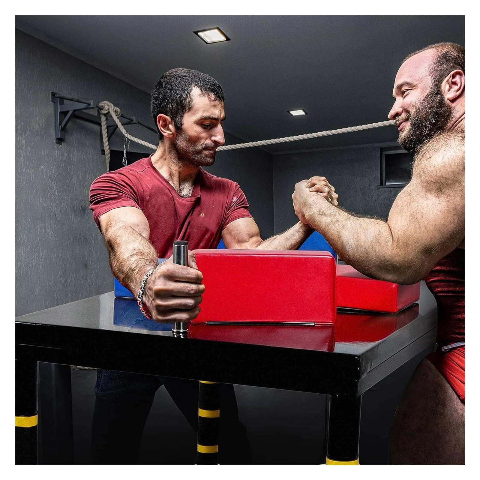 A relevant stock photo of arm wrestling table in a typical setting.