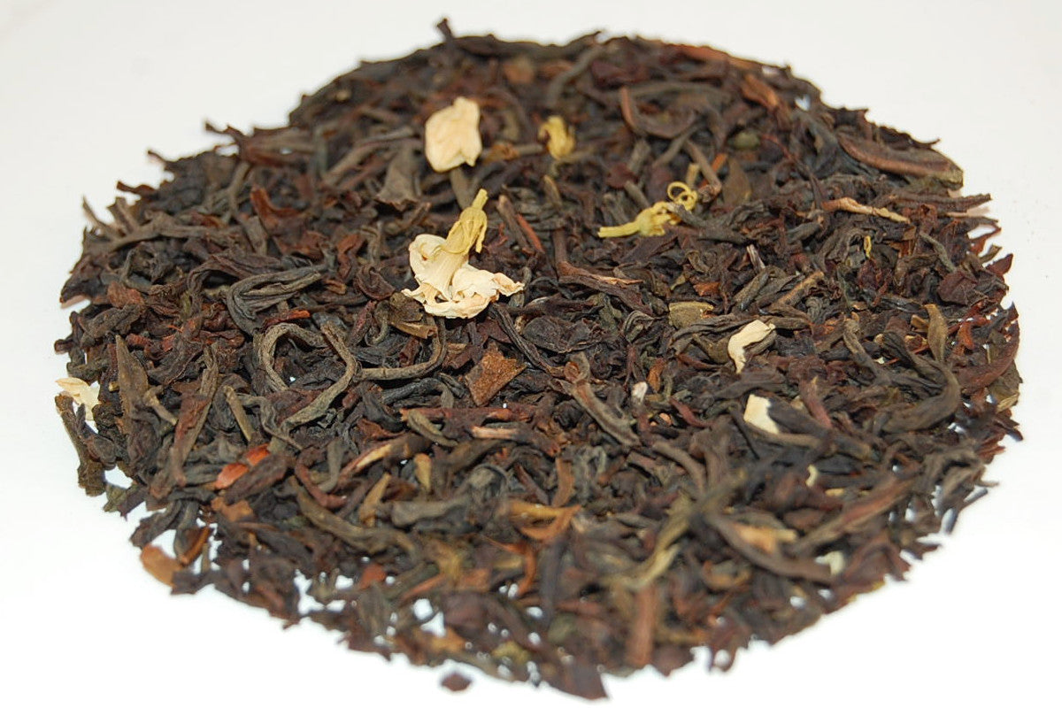 A relevant stock photo of asian loose leaf orange blossom tea in a typical setting.