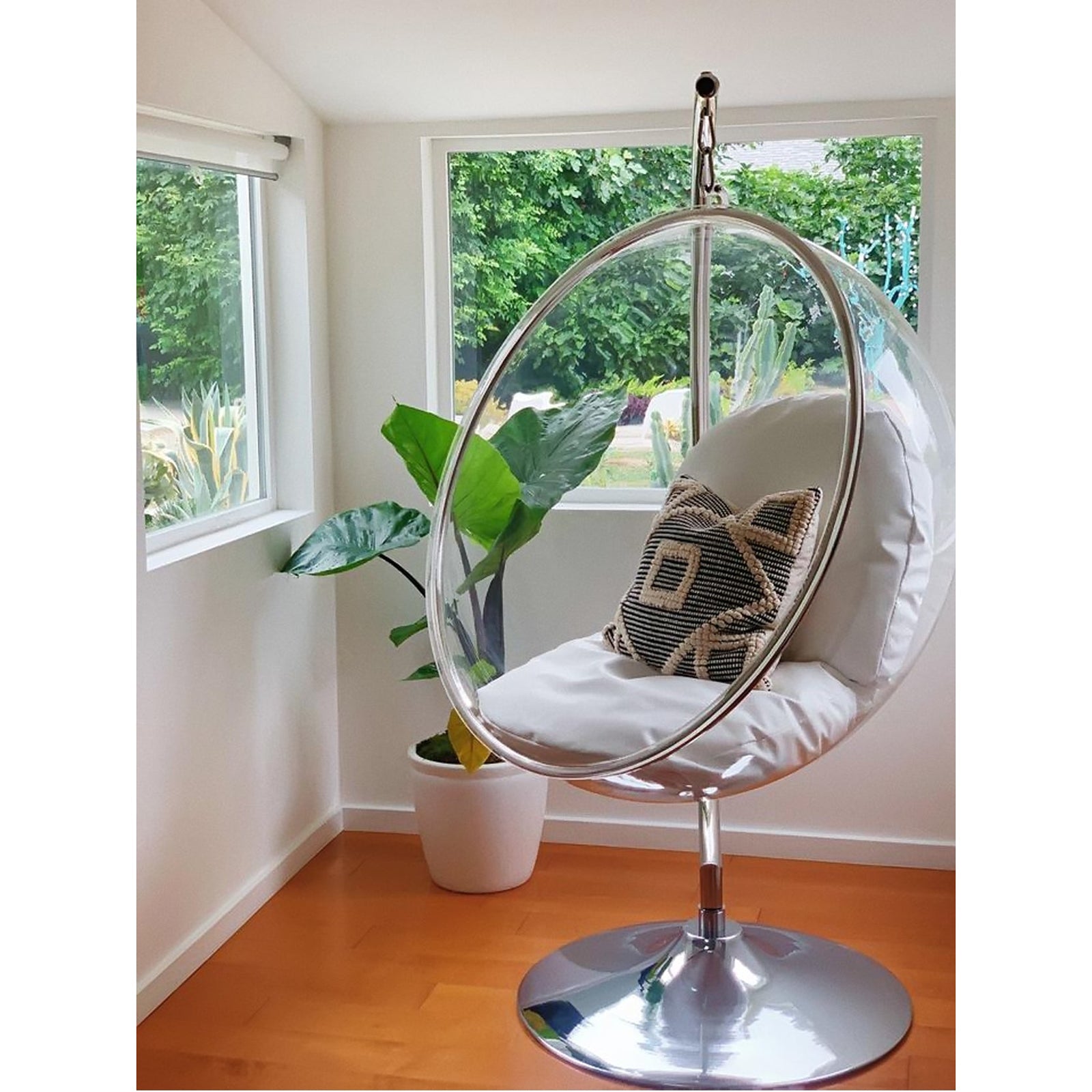 A relevant stock photo of bubble chair in a typical setting.