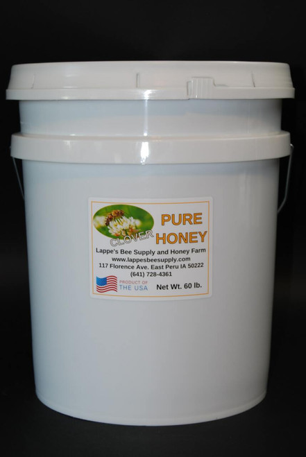 A relevant stock photo of buckets of honey for sale in a typical setting.