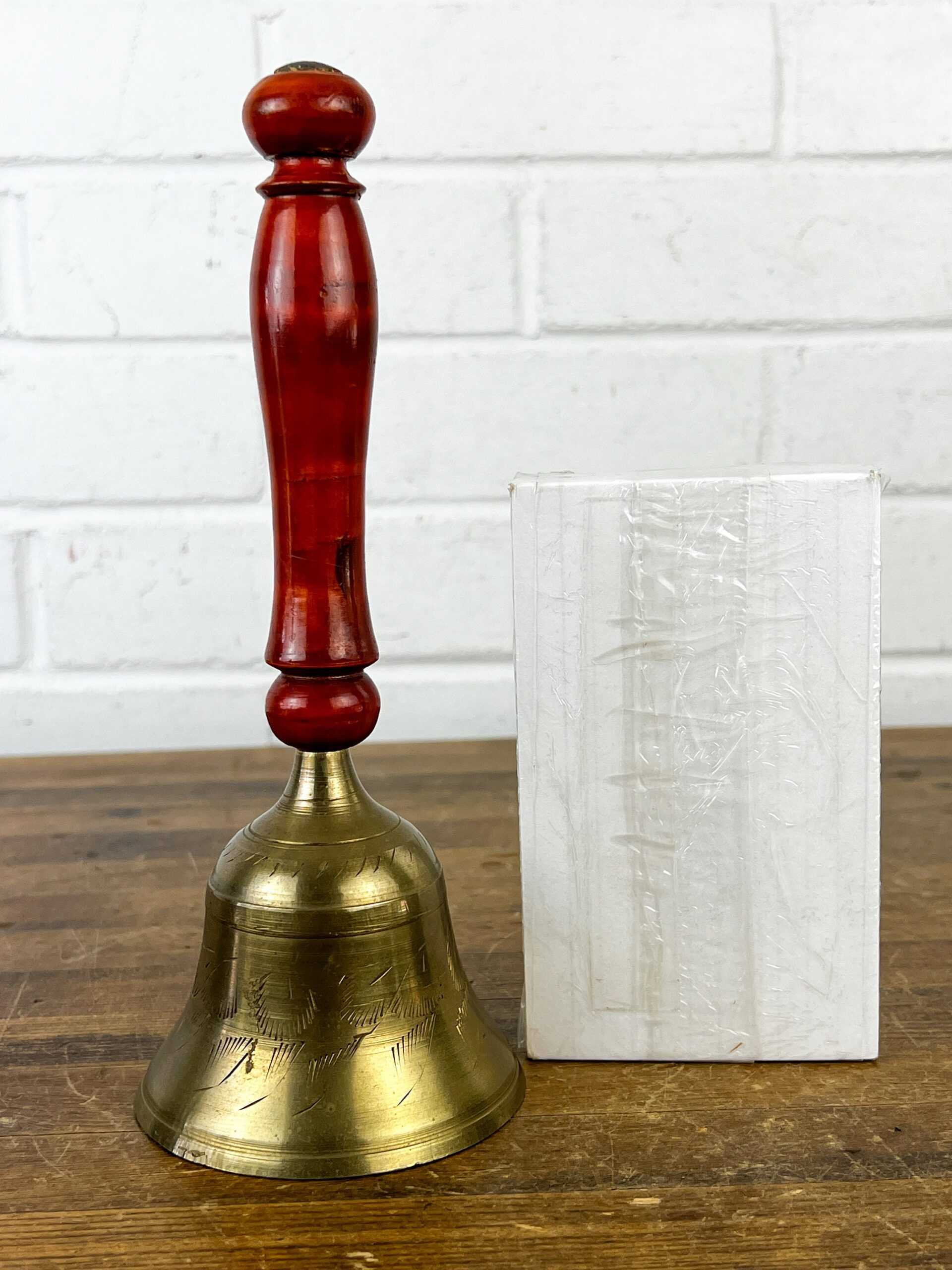 A relevant stock photo of buy vintage brass bell in a typical setting.