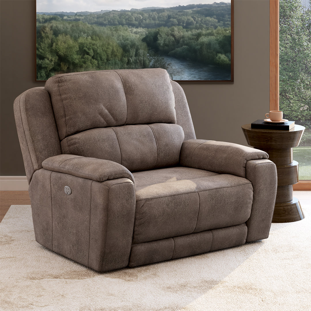 A relevant stock photo of chair and a half recliner in a typical setting.