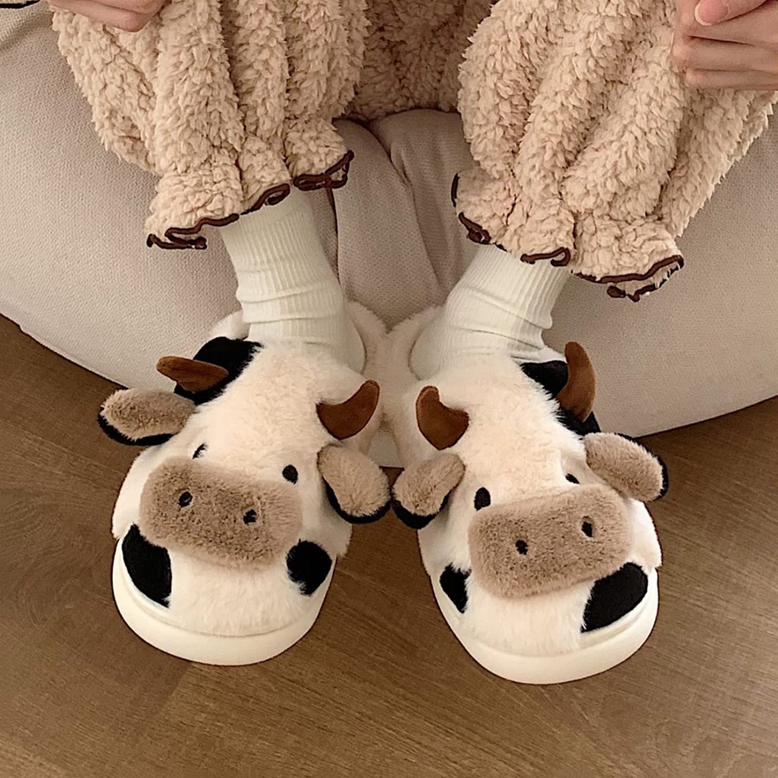 A relevant stock photo of cow slippers in a typical setting.