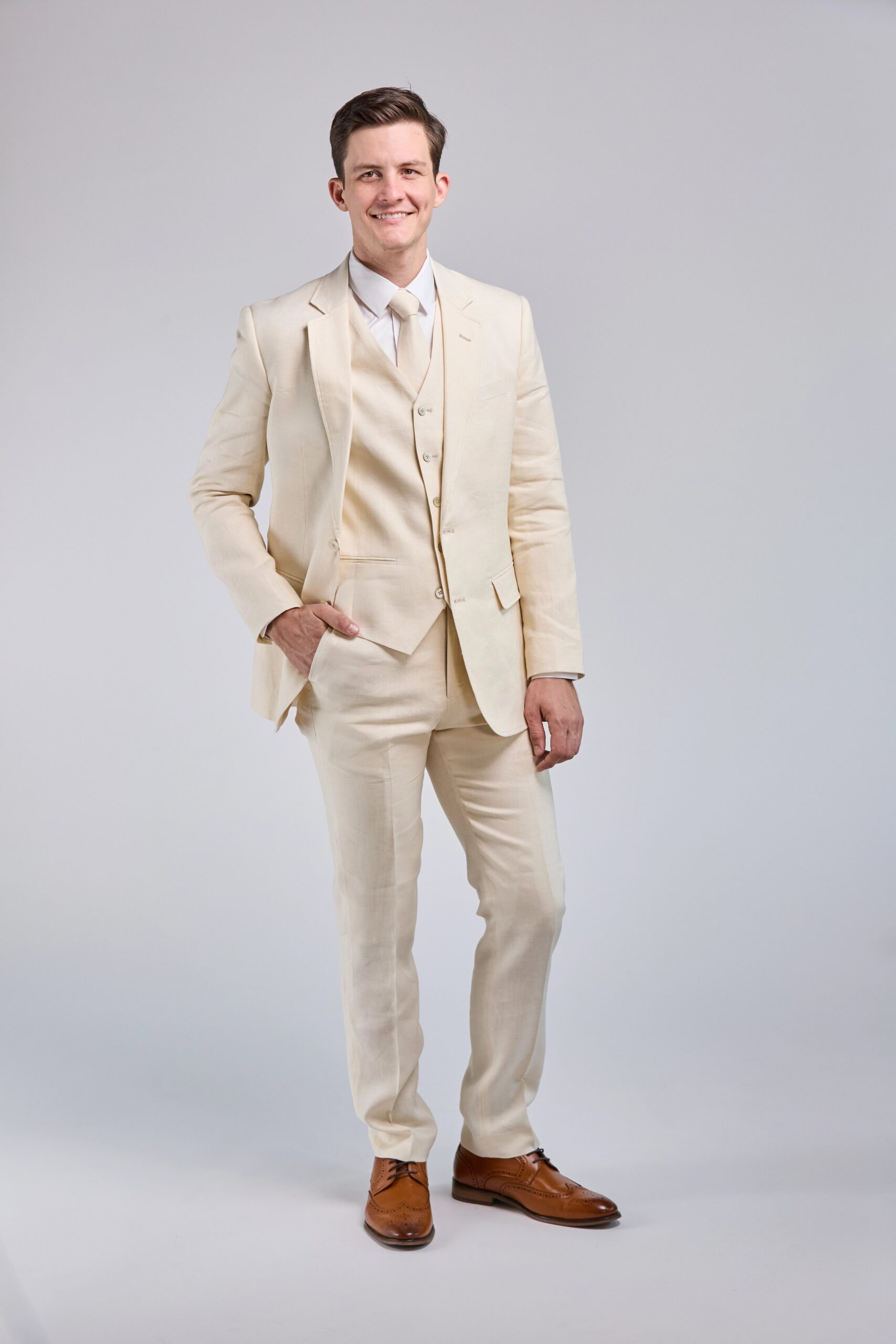 A relevant stock photo of cream suit in a typical setting.