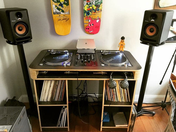 A relevant stock photo of dj table in a typical setting.