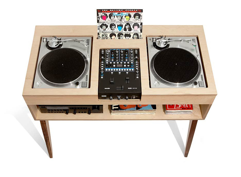 A relevant stock photo of dj table in a typical setting.