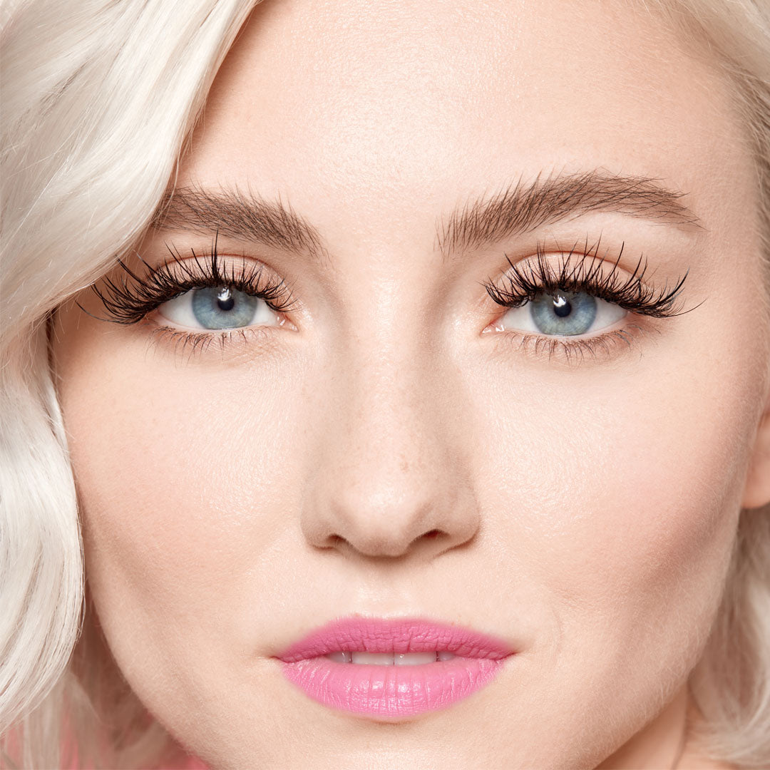 A relevant stock photo of eyelash and hair extensions in a typical setting.