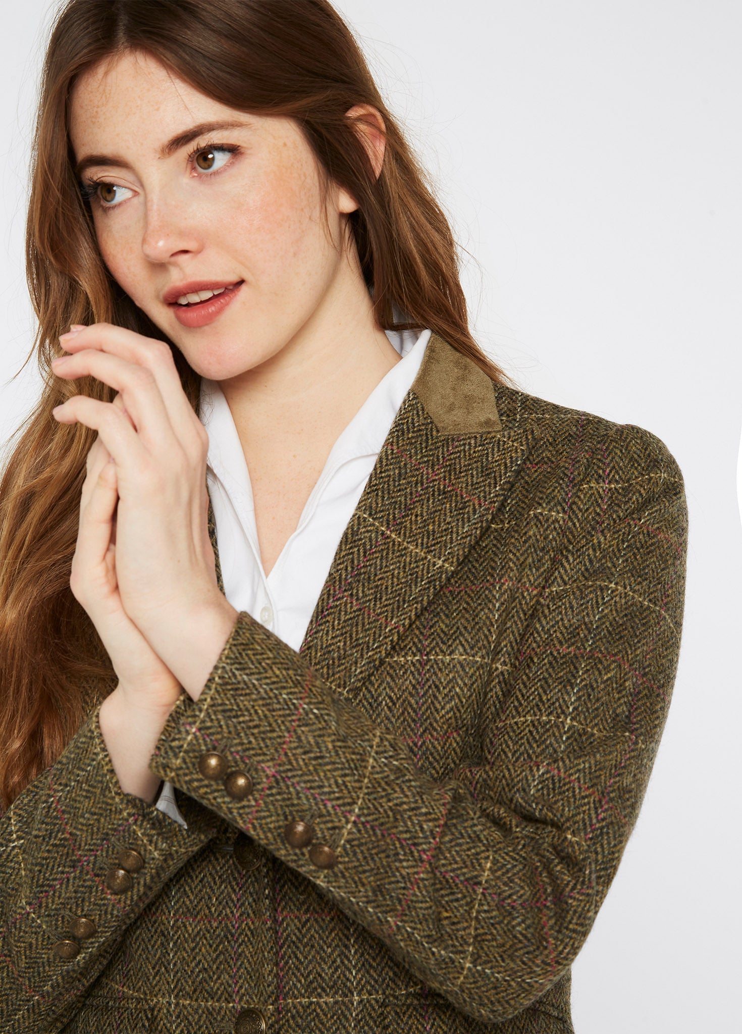 A relevant stock photo of female tweed jacket in a typical setting.