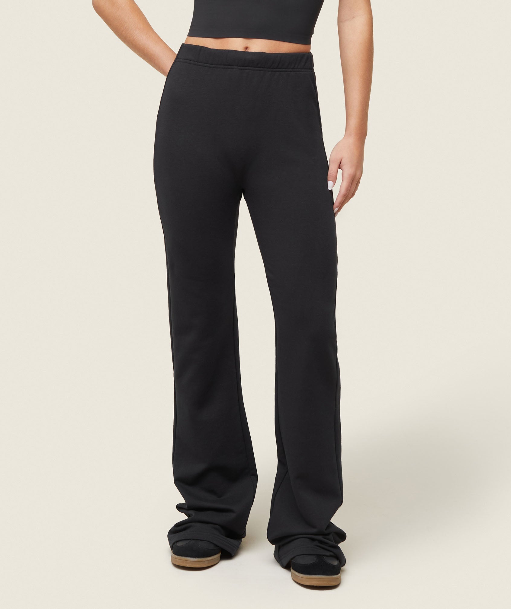 A relevant stock photo of flared sweatpants in a typical setting.