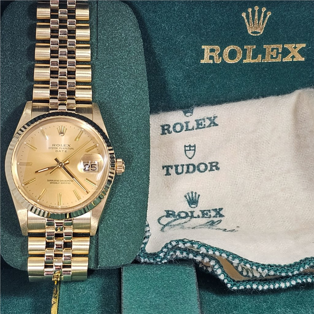 A relevant stock photo of gents gold rolex watches in a typical setting.