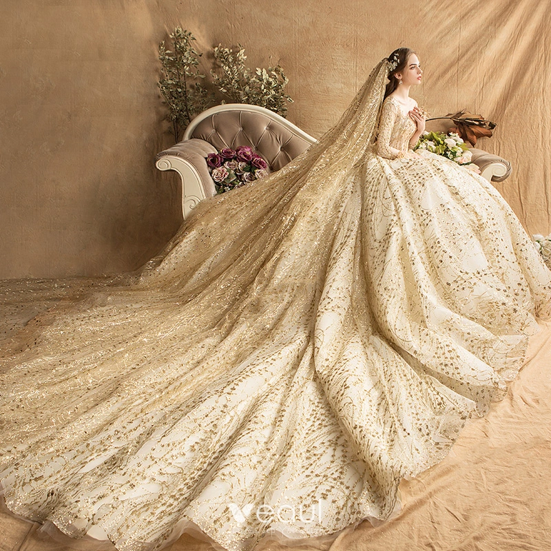 A relevant stock photo of gold wedding dresses in a typical setting.