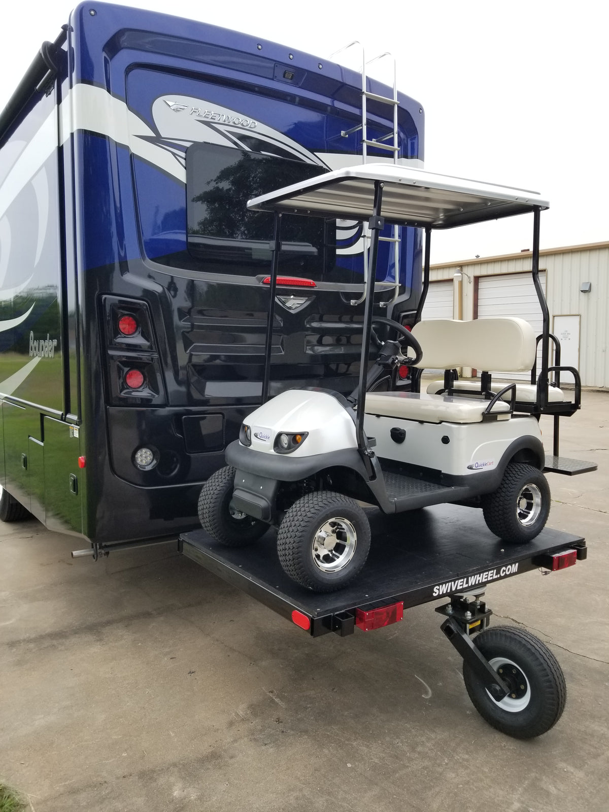 A relevant stock photo of golf cart trailer in a typical setting.