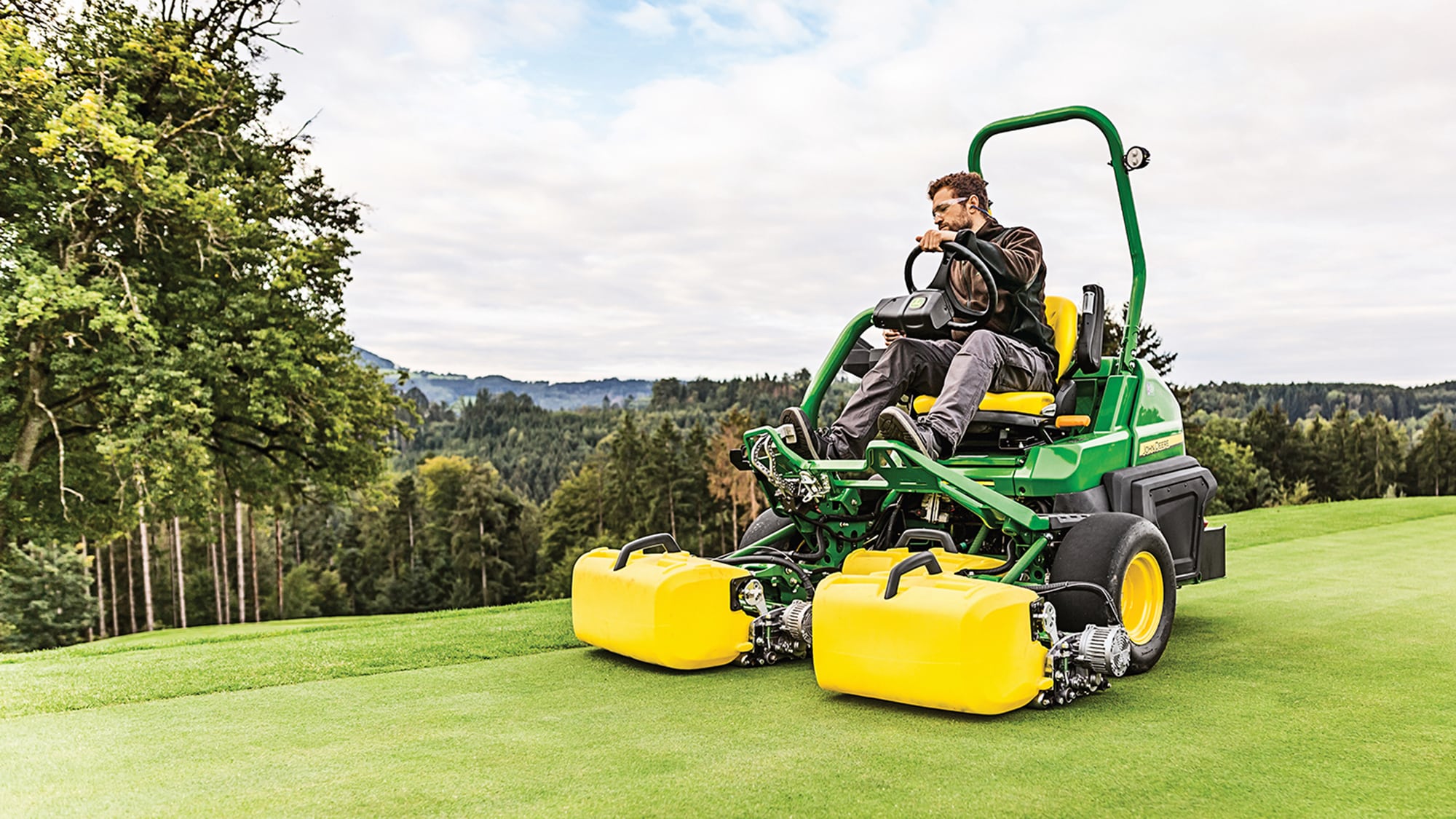 A relevant stock photo of grassland mower in a typical setting.