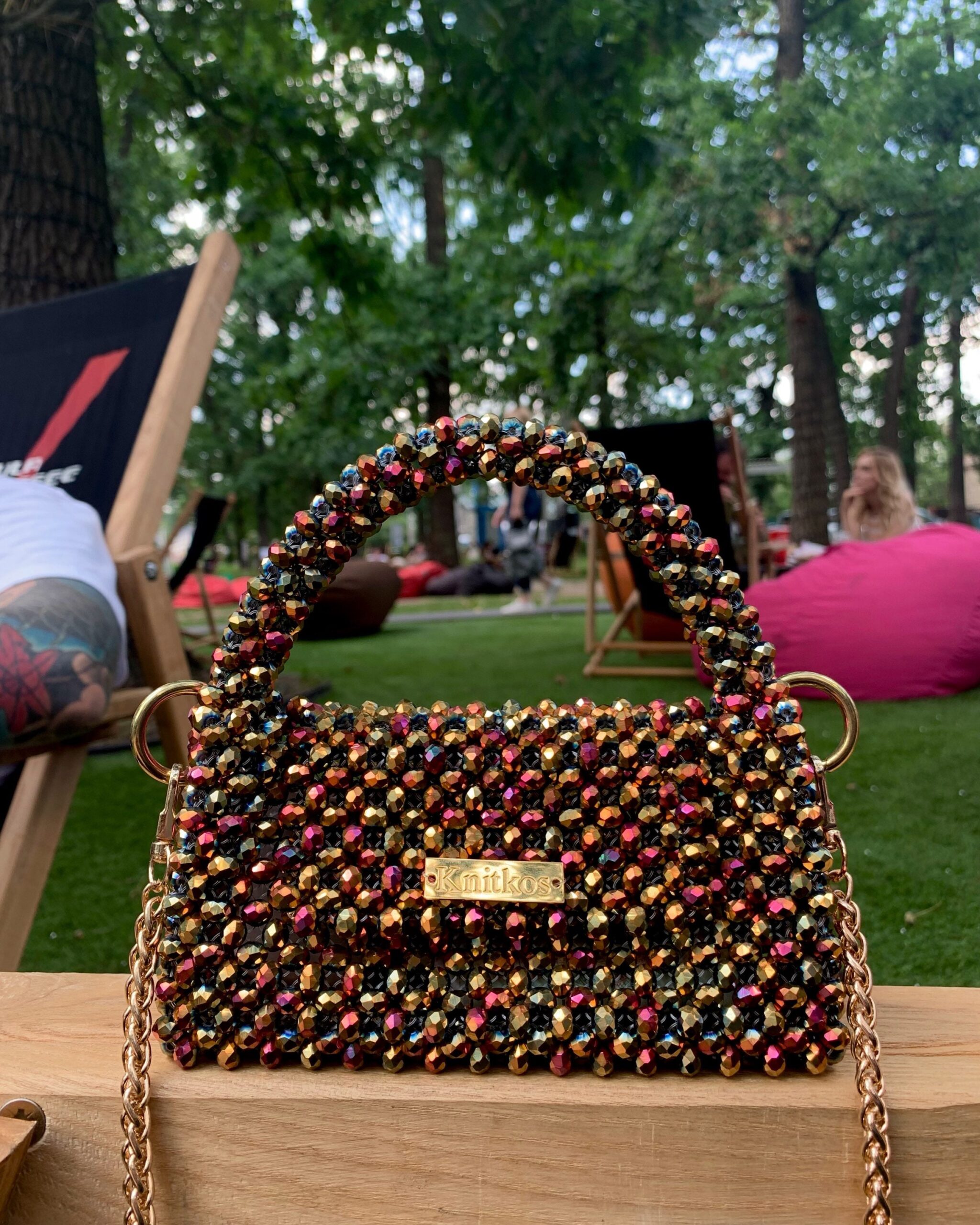 A relevant stock photo of handbags with beads in a typical setting.