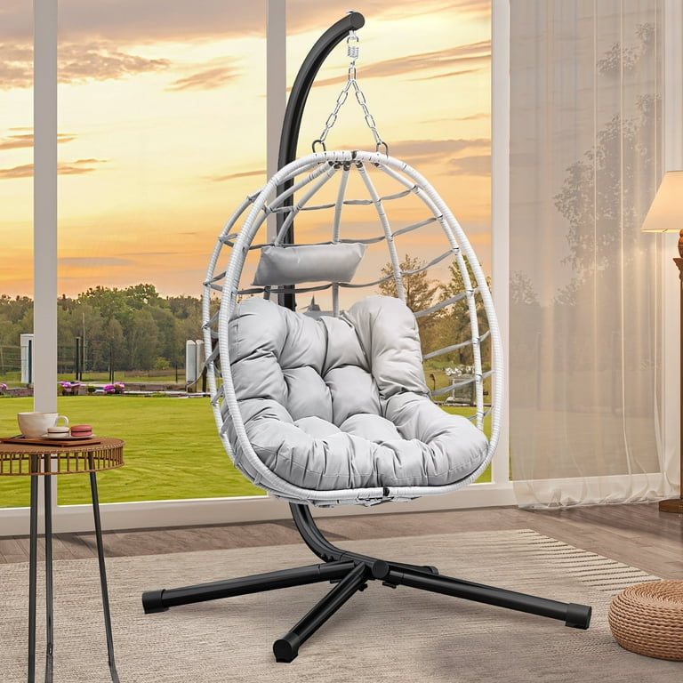 A relevant stock photo of hanging chairs chair in a typical setting.