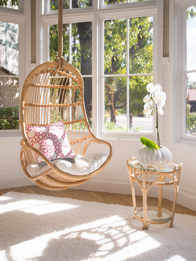 A relevant stock photo of hanging chairs chair in a typical setting.