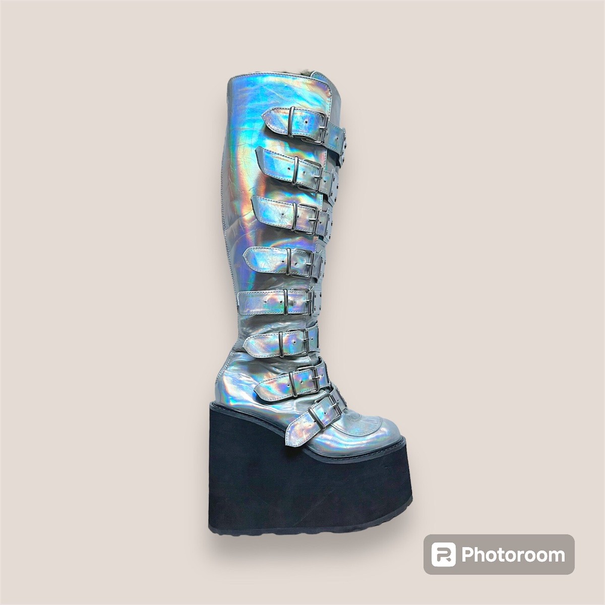 A relevant stock photo of holographic knee high space boots in a typical setting.