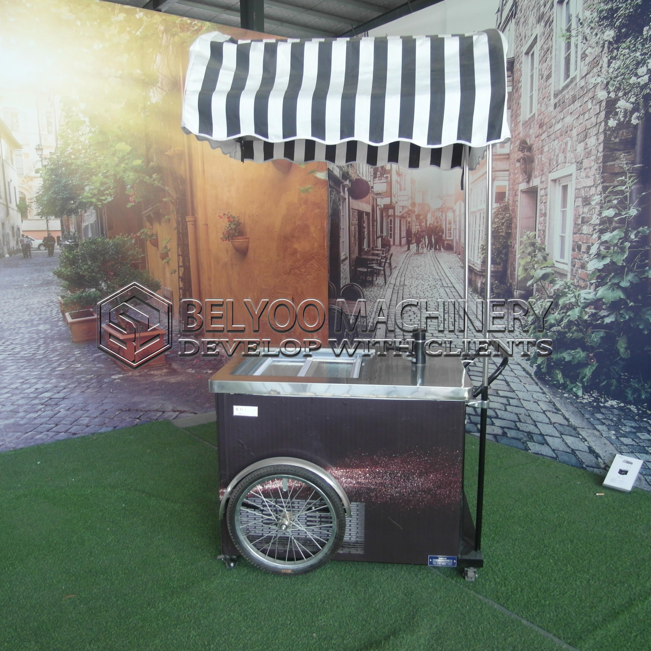A relevant stock photo of ice cream cart in a typical setting.