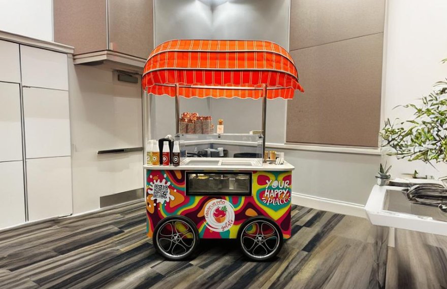 A relevant stock photo of ice cream cart in a typical setting.