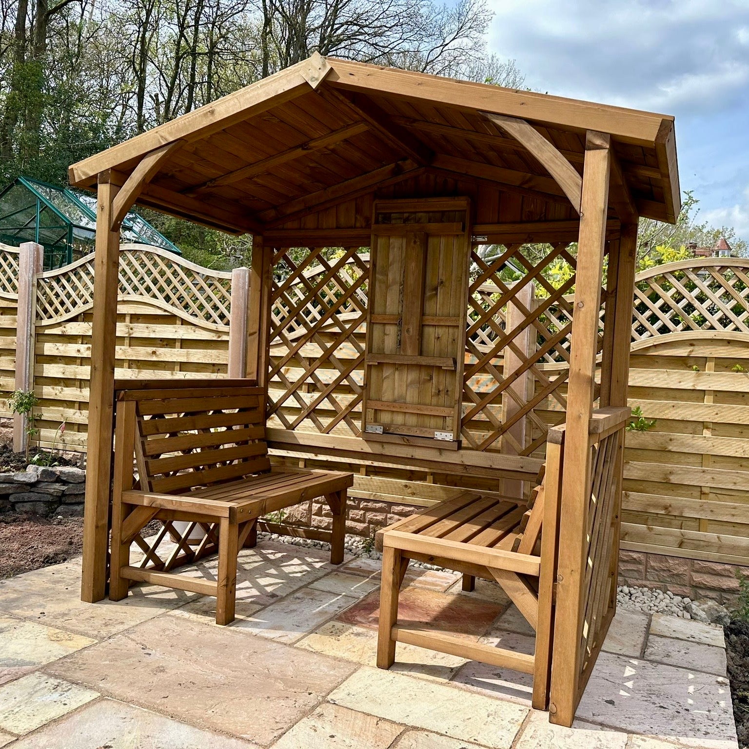 A relevant stock photo of large arbour in a typical setting.