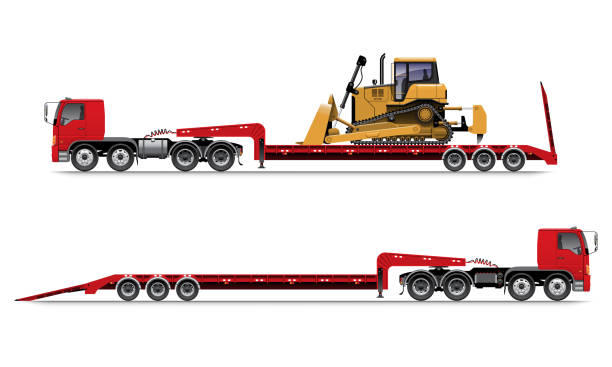 A relevant stock photo of low boy truck in a typical setting.