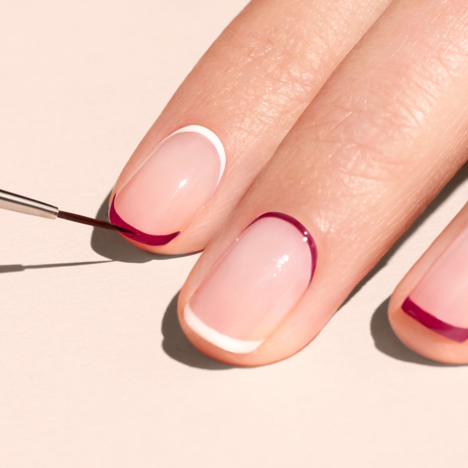 A relevant stock photo of nail art brush for french tips in a typical setting.