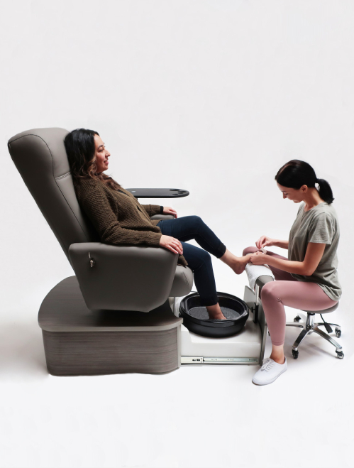 A relevant stock photo of nail technician chair in a typical setting.