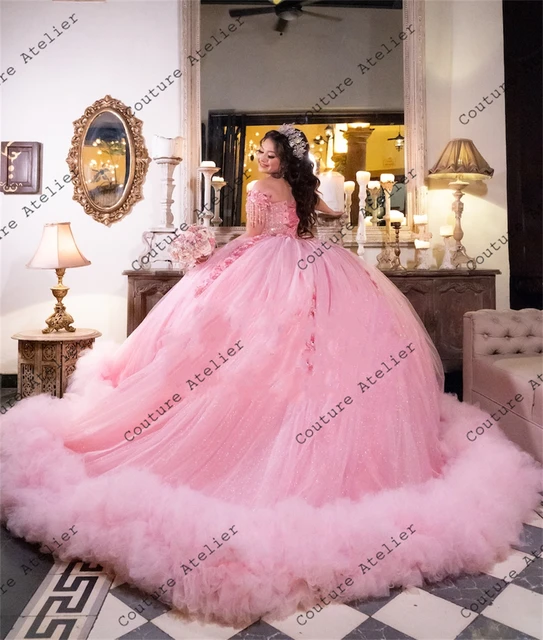 A relevant stock photo of pink fifteen dresses in a typical setting.
