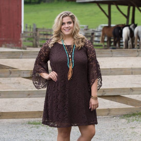 A relevant stock photo of plus size western dresses in a typical setting.