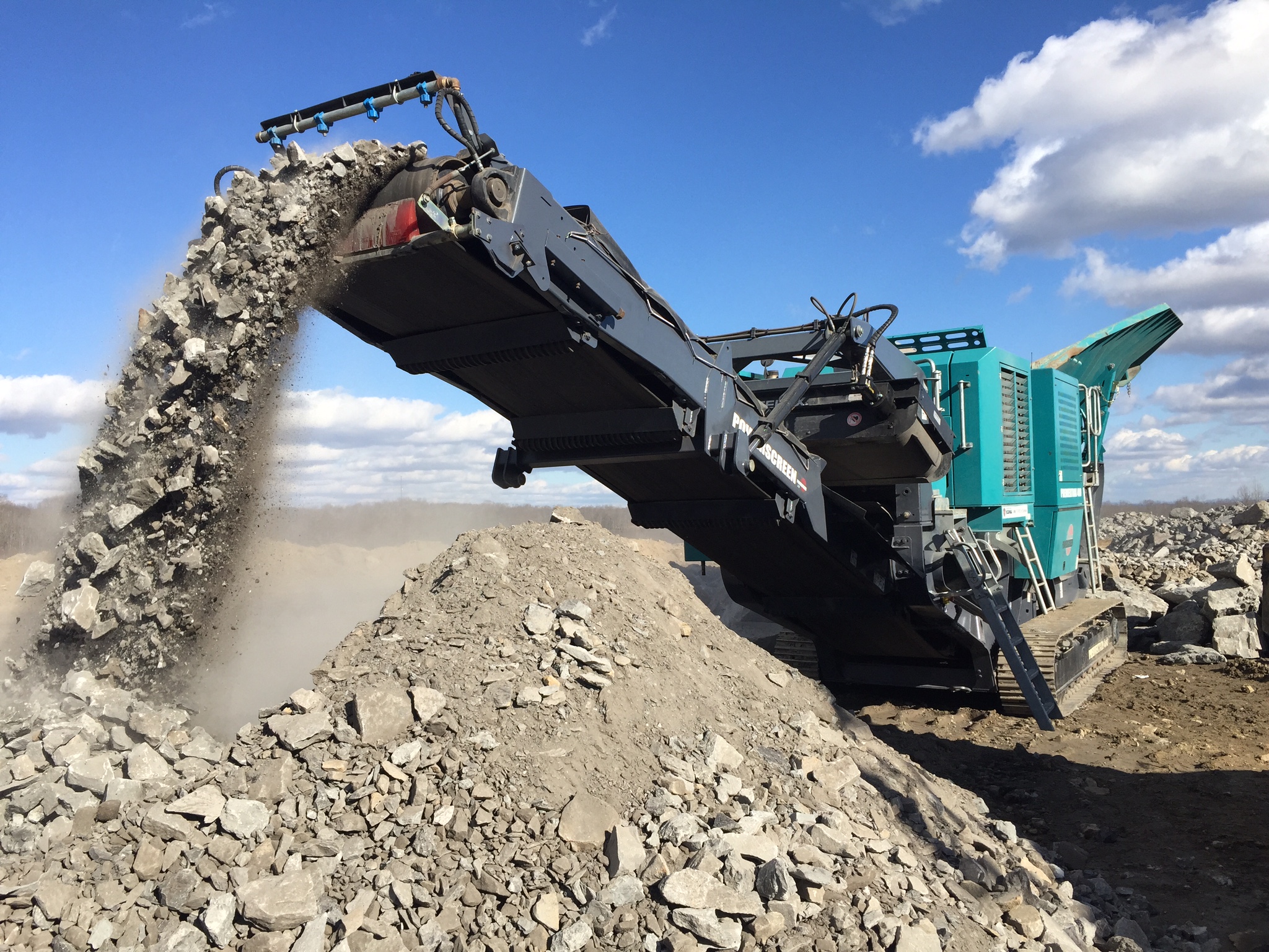 A relevant stock photo of rock crusher in a typical setting.