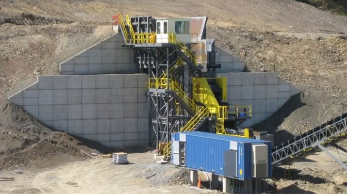 A relevant stock photo of rock crusher in a typical setting.