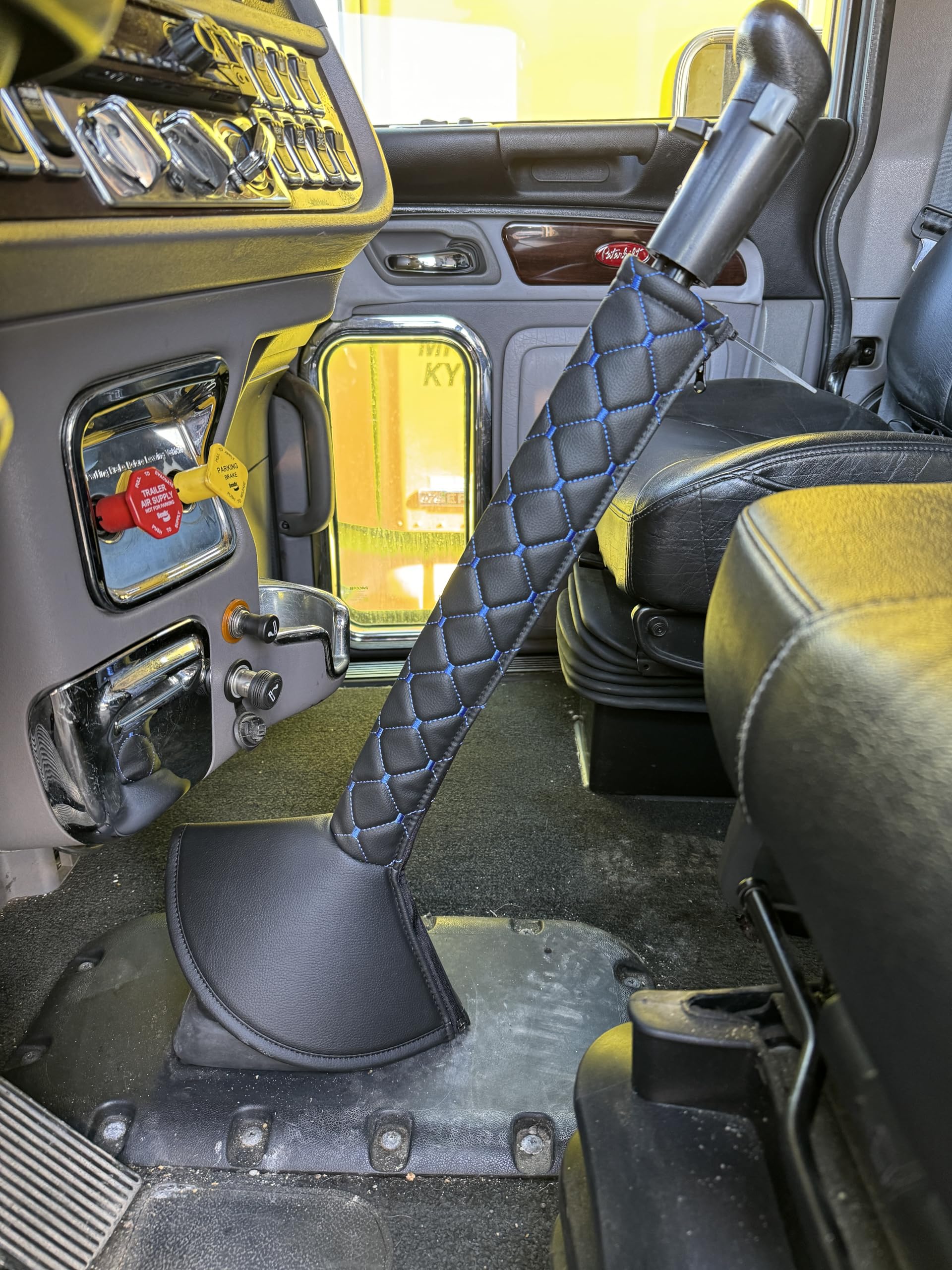 A relevant stock photo of semi-truck shift lever in a typical setting.