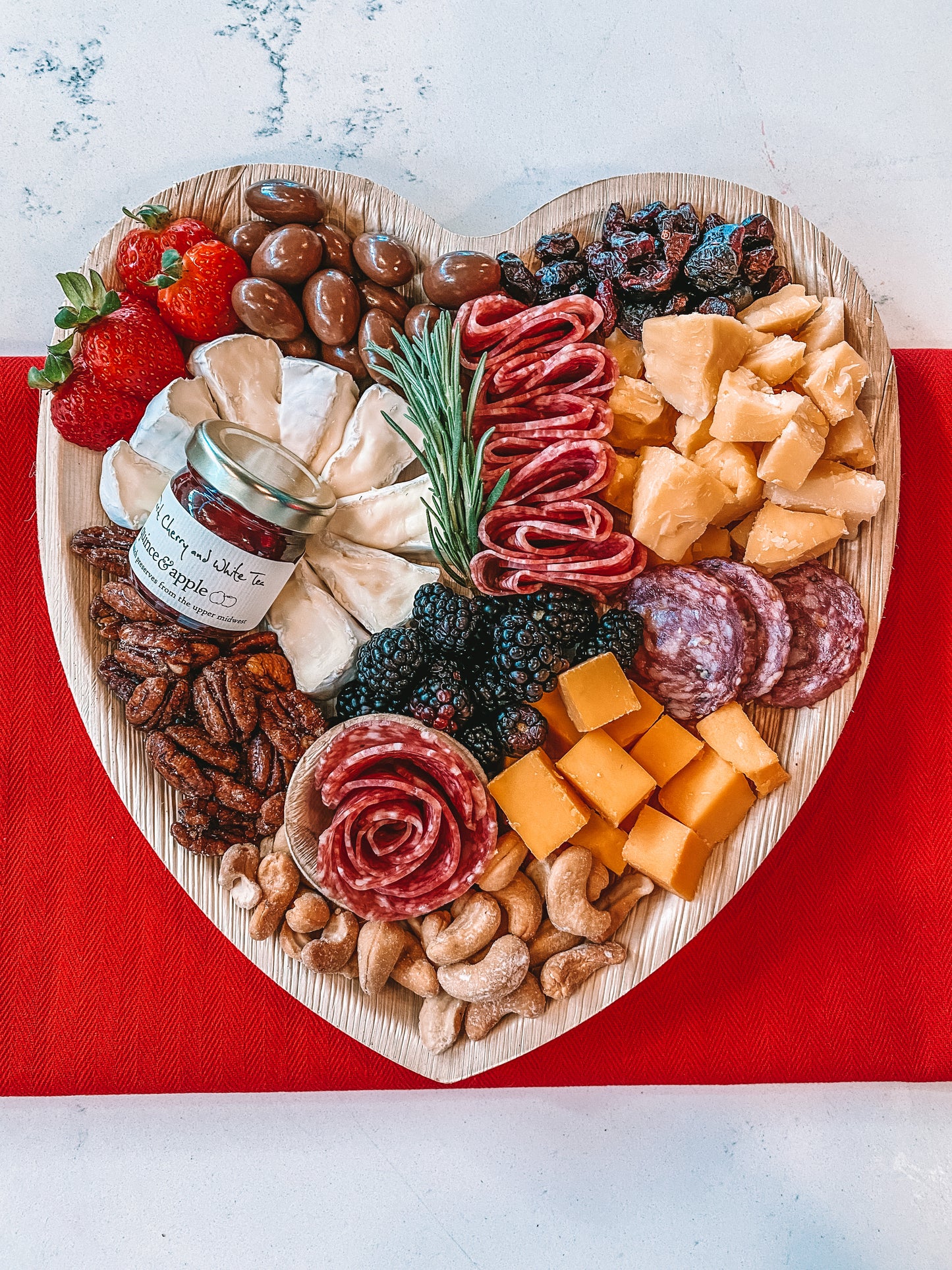 A relevant stock photo of shop heart-shaped charcuterie boards in a typical setting.