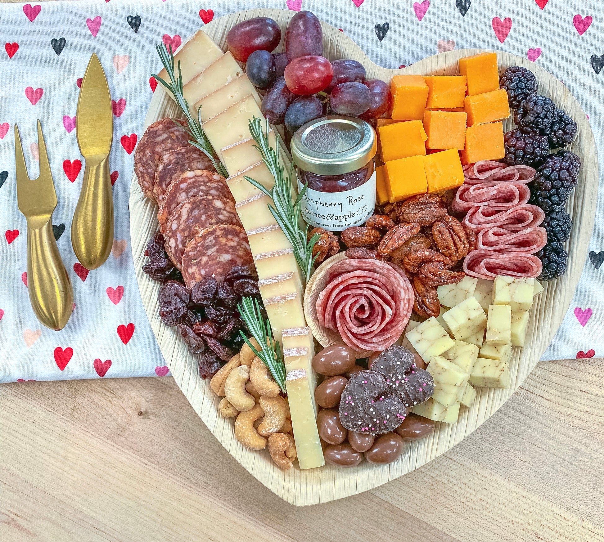 A relevant stock photo of shop heart-shaped charcuterie boards in a typical setting.
