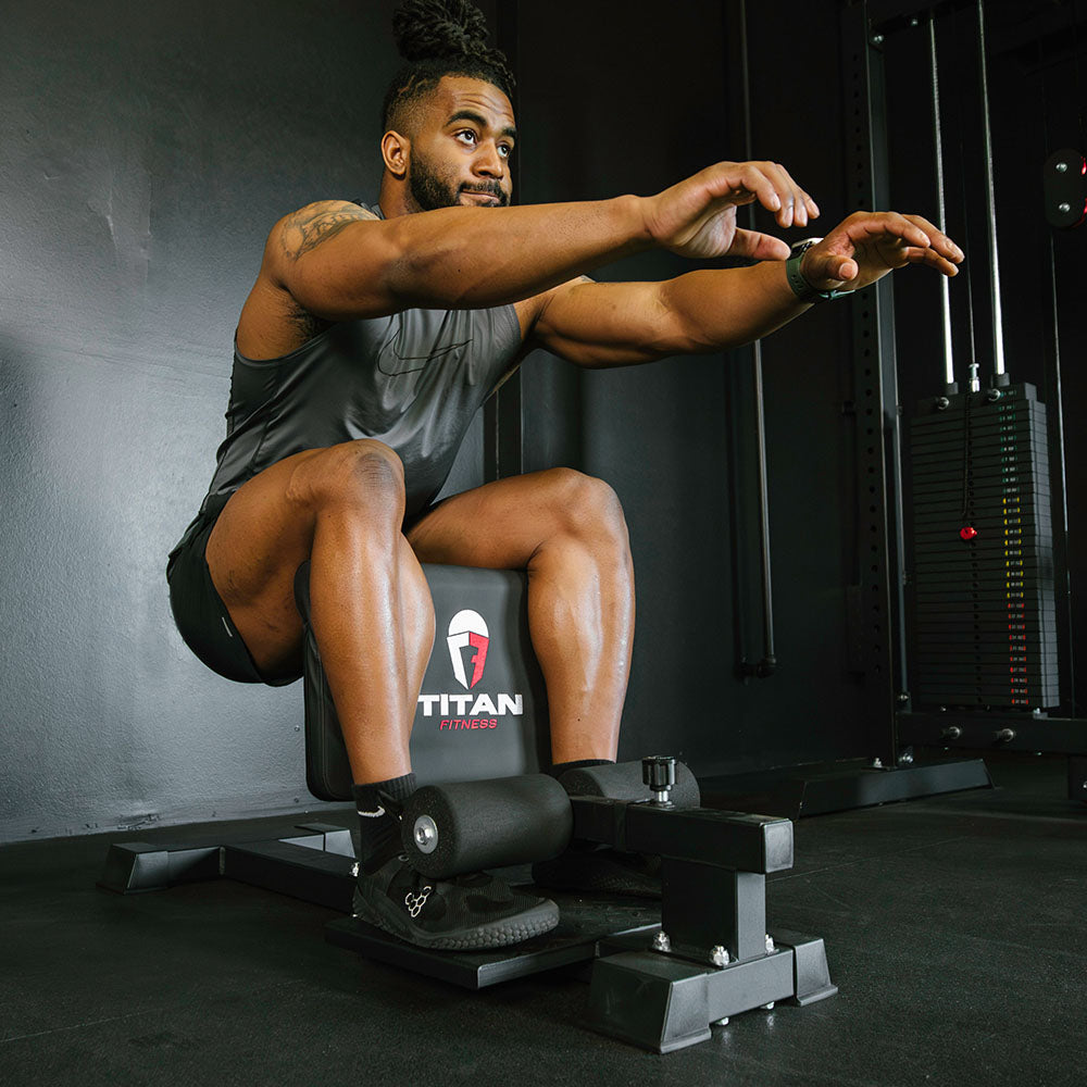 A relevant stock photo of sissy squat machine in a typical setting.