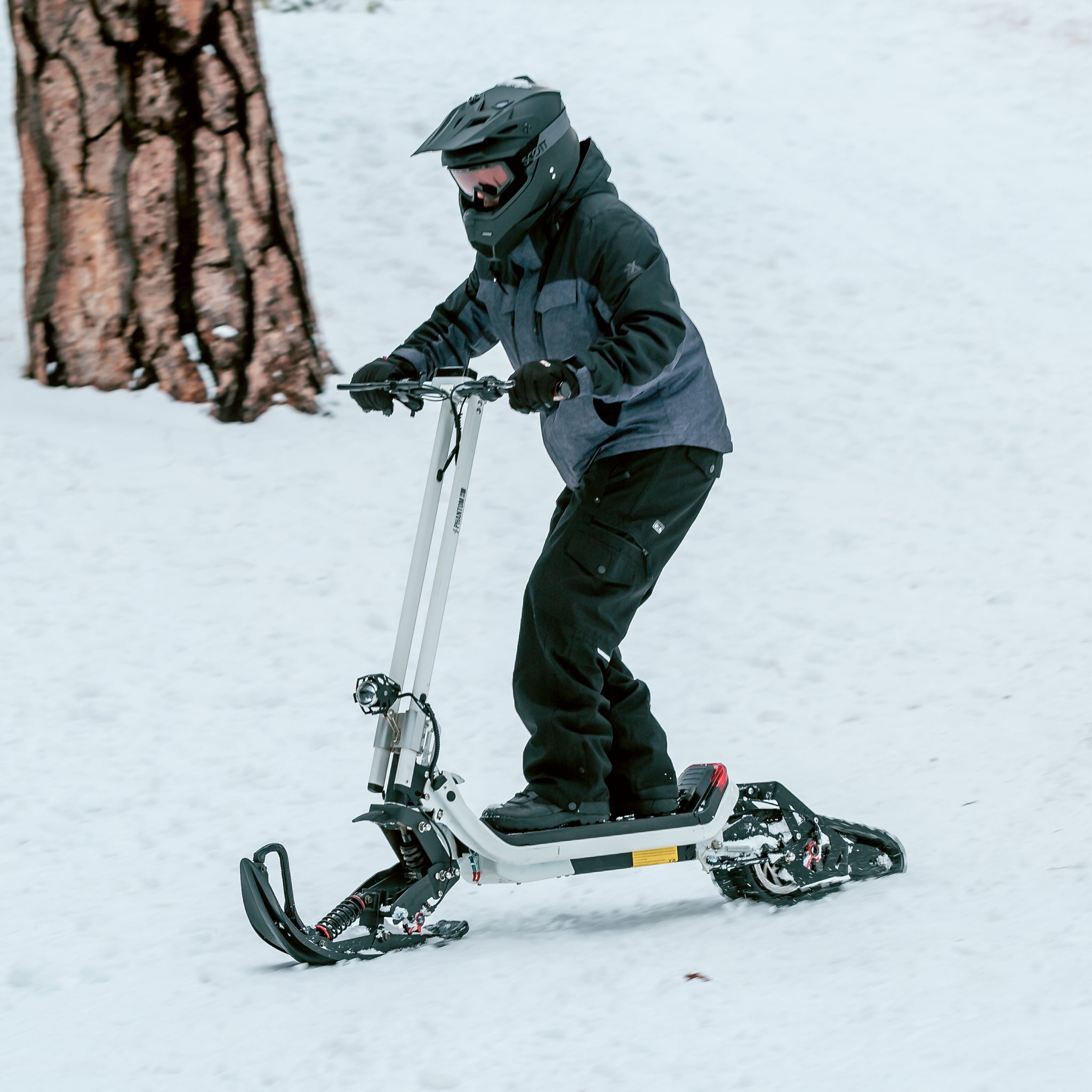 A relevant stock photo of snow scooter in a typical setting.