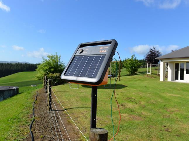 A relevant stock photo of solar electric fence in a typical setting.