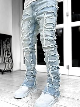A relevant stock photo of stacked jeans mens in a typical setting.