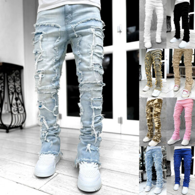 A relevant stock photo of stacked jeans mens in a typical setting.