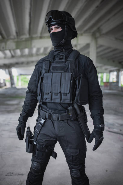 A relevant stock photo of swat uniform in a typical setting.