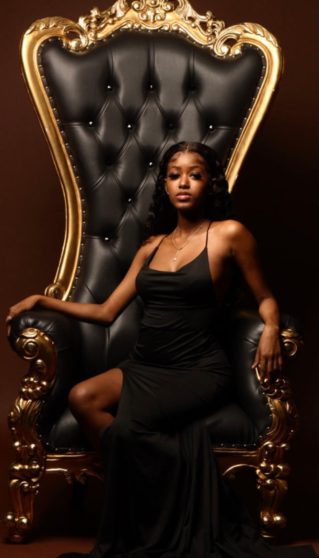 A relevant stock photo of throne chair in a typical setting.