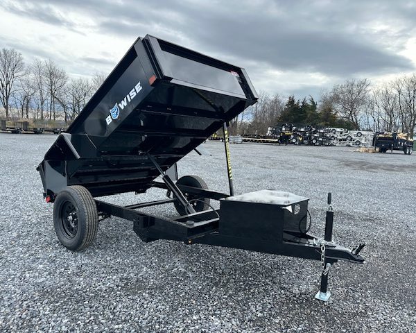 A relevant stock photo of used dump trailers for sale in a typical setting.