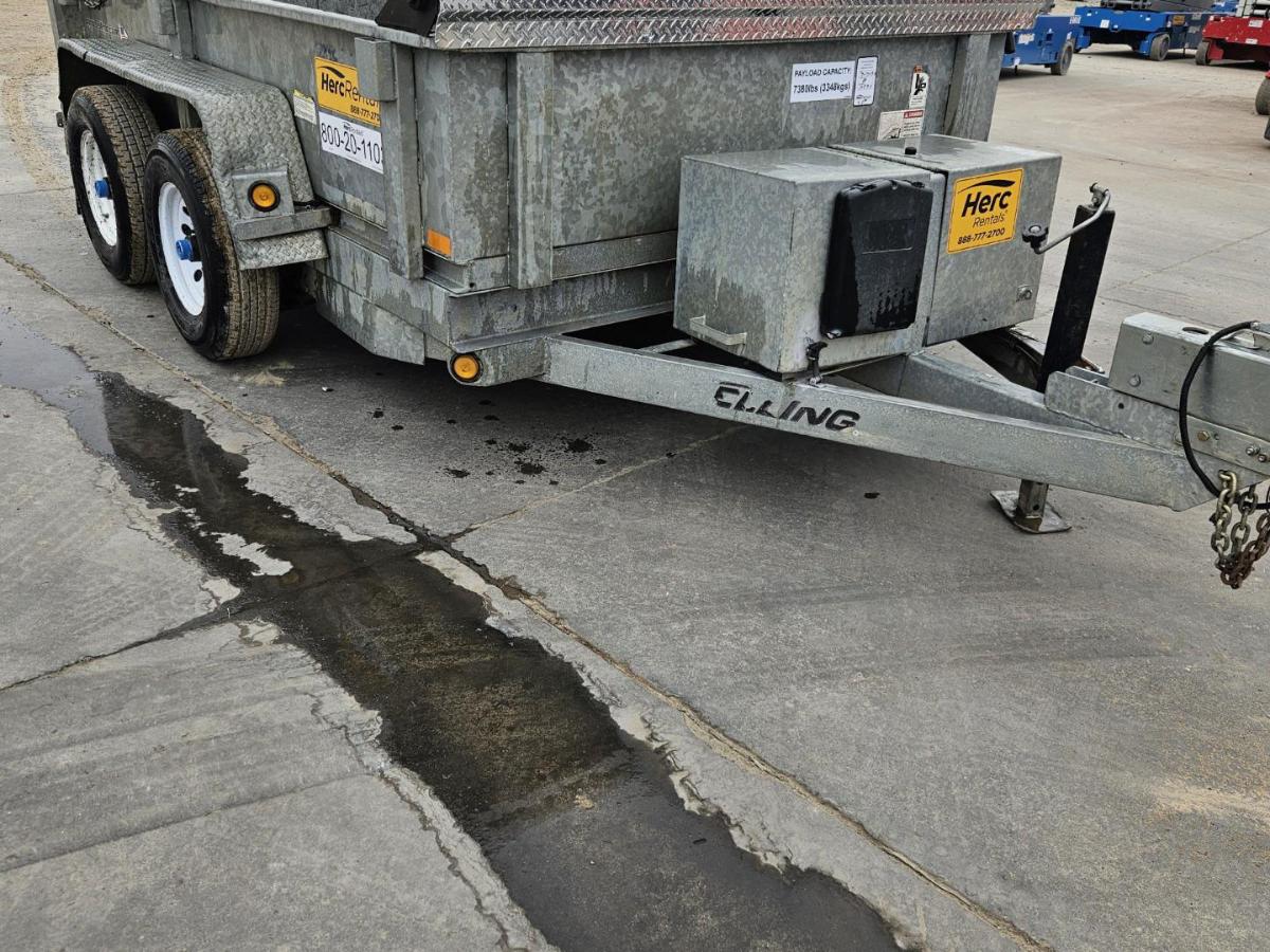 A relevant stock photo of used dump trailers for sale in a typical setting.