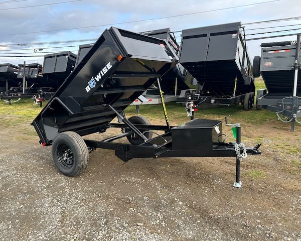 A relevant stock photo of used dump trailers for sale in a typical setting.