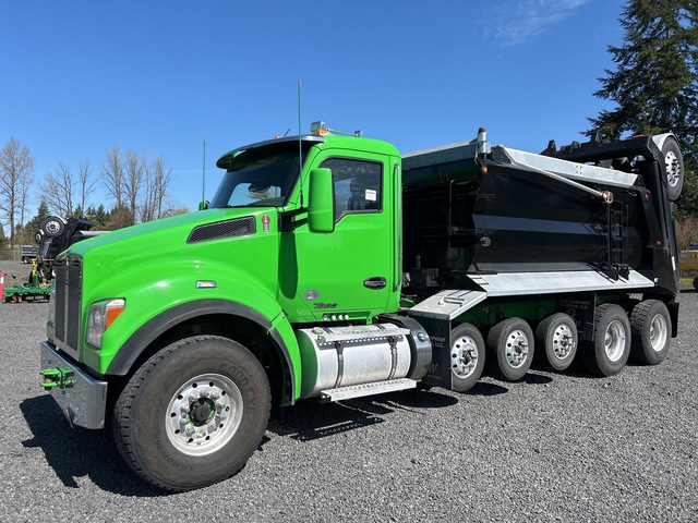 A relevant stock photo of used dump trucks for sale in a typical setting.