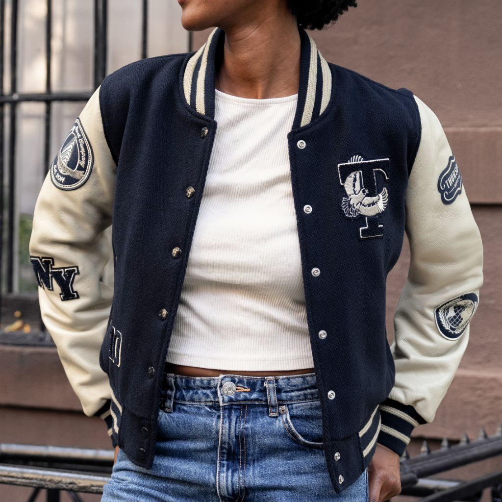 A relevant stock photo of varsity jacket women in a typical setting.