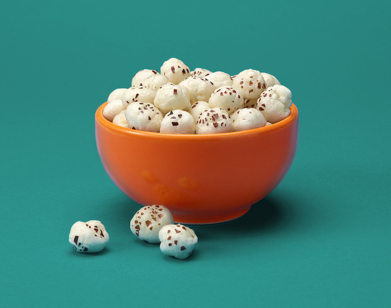 A relevant stock photo of water lily seeds in a typical setting.