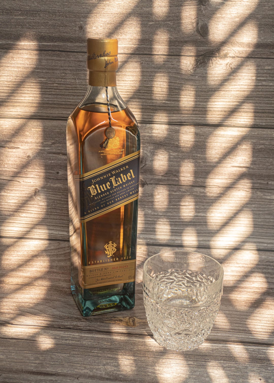 A relevant stock photo of whiskey bottle in a typical setting.