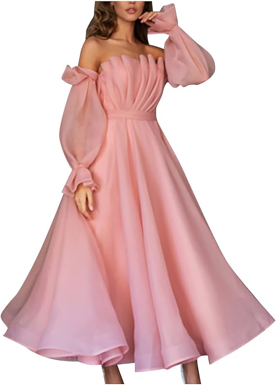A relevant stock photo of women's light pink off the shoulder dress for a festival in a typical setting.